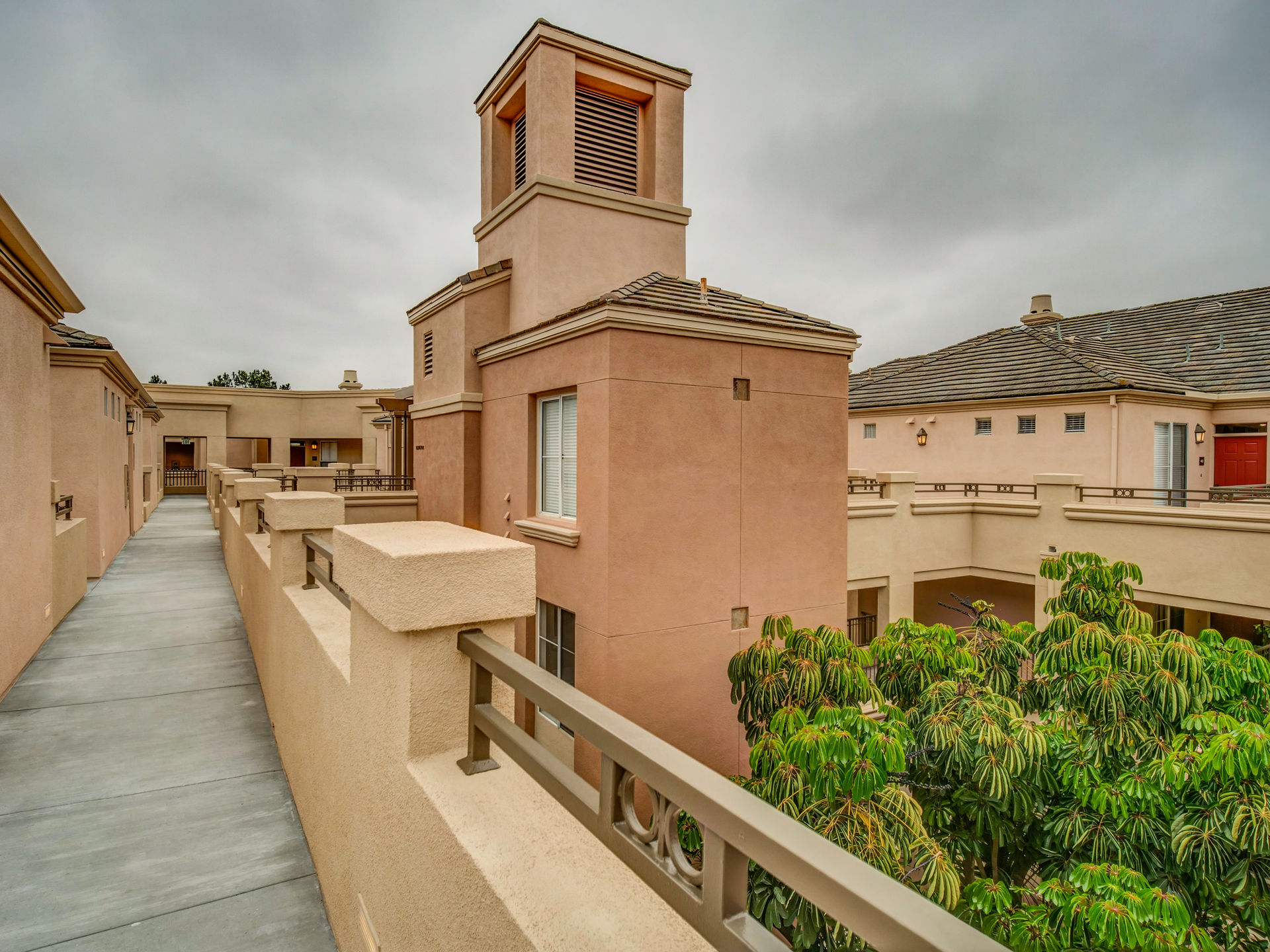 Villa Siena Apartment Homes exterior walkway and tower