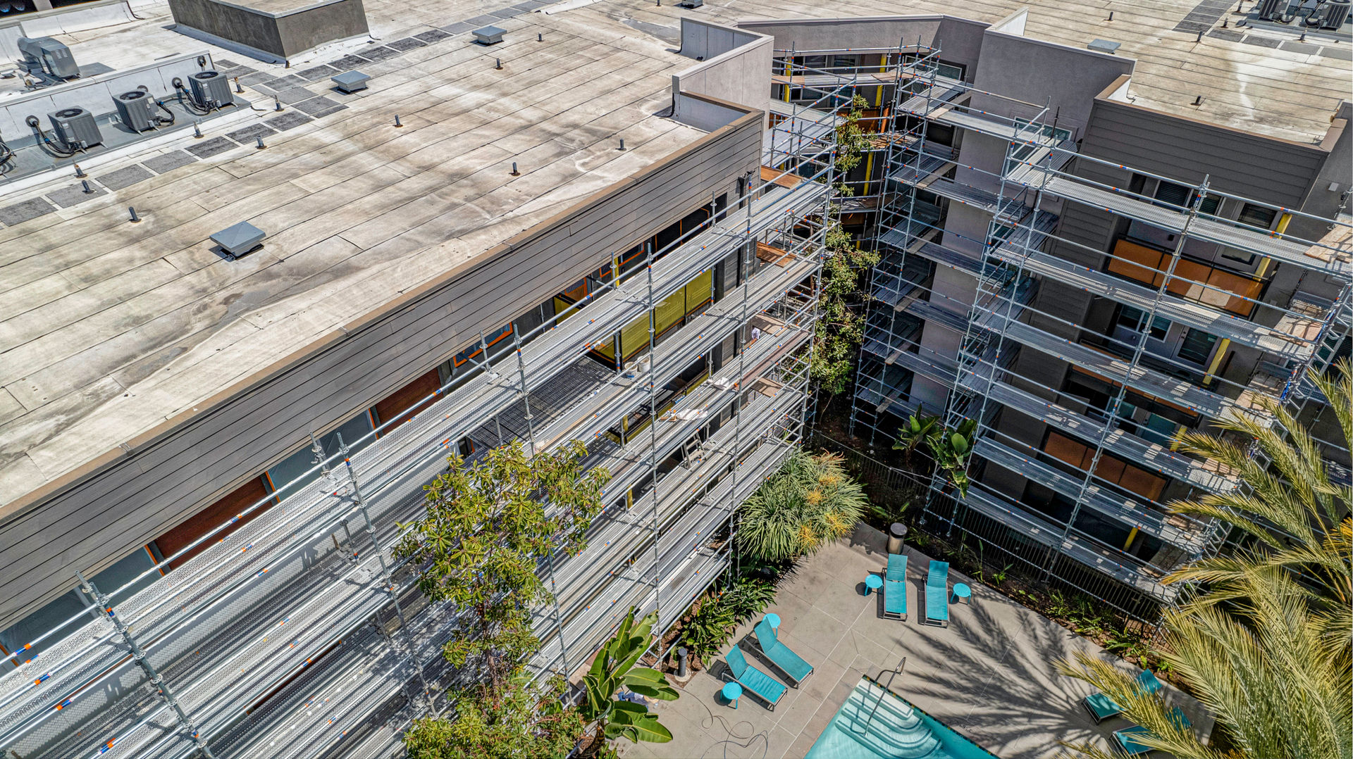 BLVD63 Apartments exterior during renovation with scaffolding