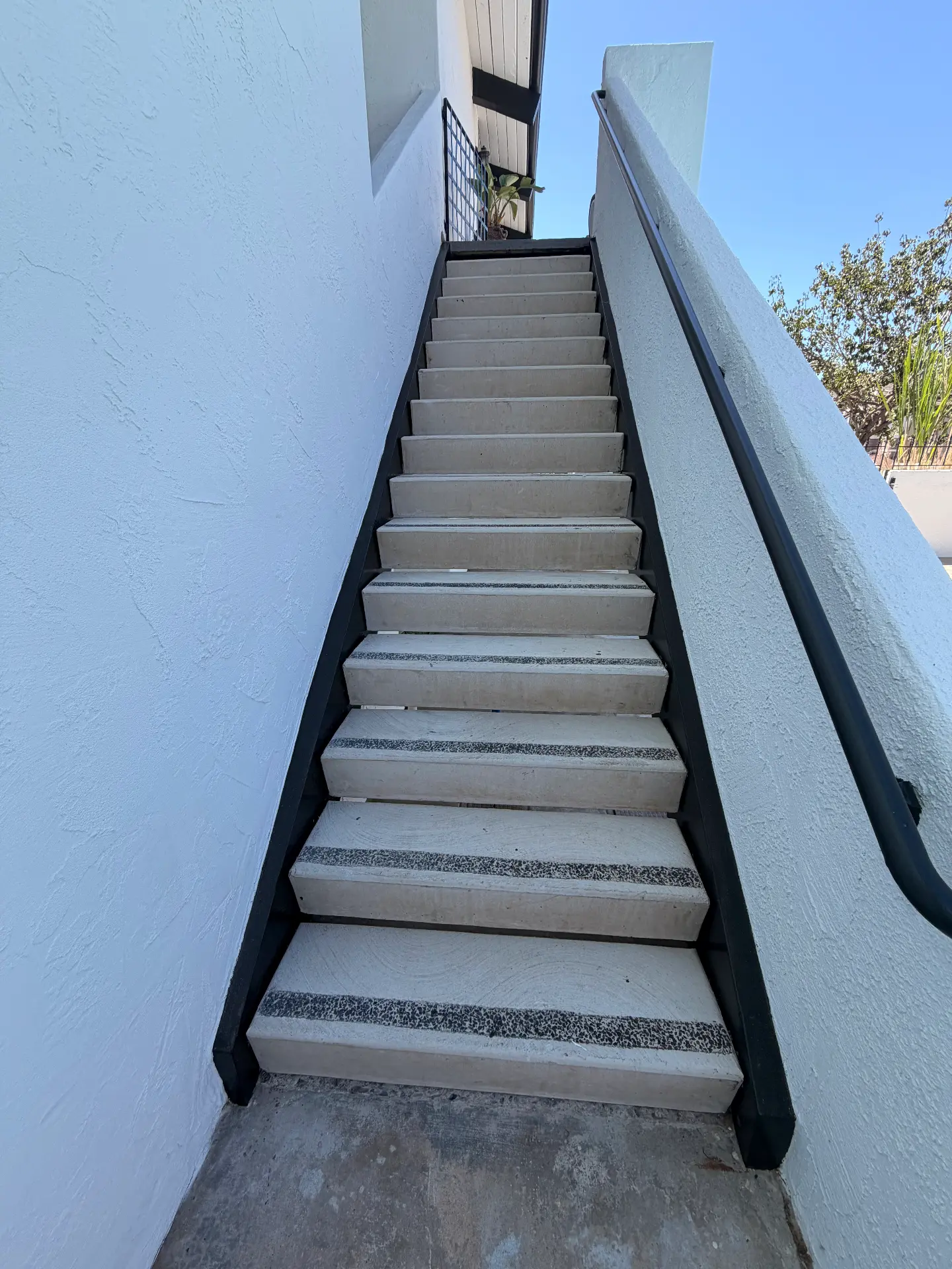 Rebuilt stairway with new treads and safety striping